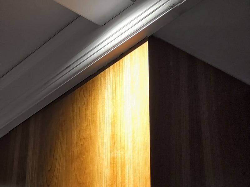 Recessed LED downlights creating warm, even lighting in a finished room
