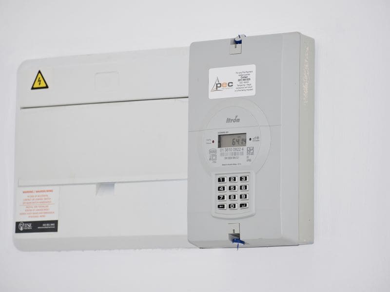 Clean meter tails and consumer unit installation on a utility wall