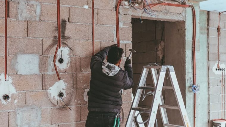 Brightwell electrician installing new wiring during a home renovation in Romford